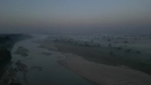 High altitude aerial view of thick morning fog covering rural countryside l.. Video stock 342917906