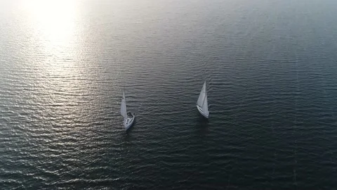High altitude aerial view of two sloops on quiet and lonely ocean 4k Stock Footage 157067591