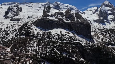 High Altitude Backward Ascent Revealing Alpine Pass Road and Snowy Peaks Video stock 339529012