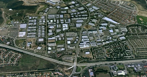 High-altitude circular tracking shot of a small city office park Stock Footage 97179318