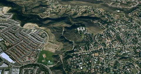 High-altitude circular tracking shot of a small city green belt Stock Footage 97180131