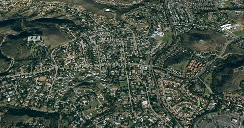High-altitude circular tracking shot: small city residential area Stock Footage 97180654