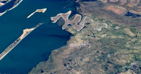 High-altitude circular tracking shot of coastland in Zambia Stock Footage 97326389