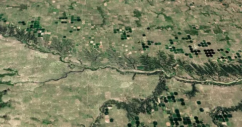 High-altitude circular tracking shot of farmland in Nebraska Stock Footage 97344284