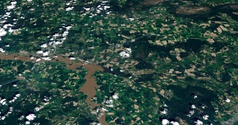 High-altitude circular tracking shot of farmland in Germany Stock Footage 97427908