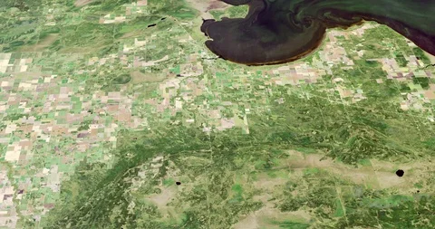 High-altitude circular tracking shot: Northwest Angle farmlands Stock Footage 97456535