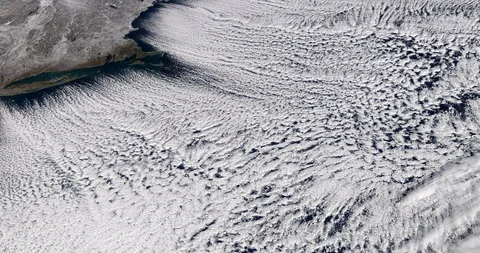 High-altitude circular tracking shot of clouds over the US east coast Stock Footage 97653501