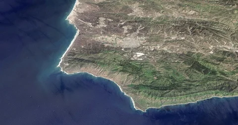 High-altitude circular tracking shot of California's Pacific Coast Video stock 97660928