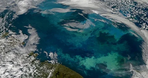 High-altitude circular tracking shot of clouds over the Barents Sea Stock Footage 97669120