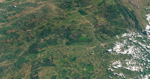 High-altitude circular tracking shot of land at the Zimbabwe Mozambique border Stock Footage 118462616