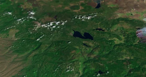 High-altitude circular tracking shot, mountains in N California, w/ tilt-shift Stock Footage 118522282