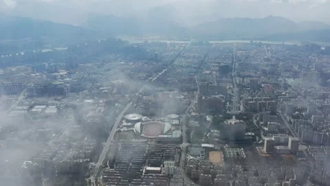 High Altitude Cloud Piercing Aerial View of Lishui Sports Square Stock Footage 319877142
