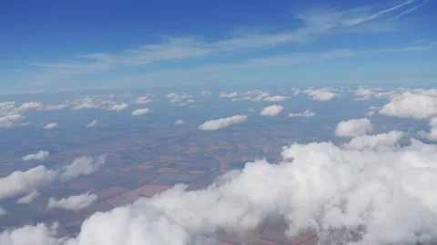 High-altitude cloudscape viewed from an airplane in 4k Stock Footage 283828195