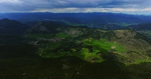High Altitude Descend Sun Rays Passing Through Thick Clouds Over Mountain Stock-Footage 300479073