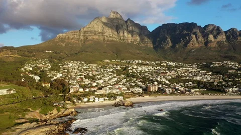 High Altitude Dolly Shot at Cape Town's Camps Bay Beach with Table Stock Footage 118670787