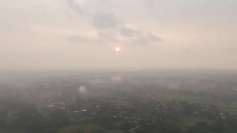 High Altitude Drone Aerial View of Thick Foggy Sunrise Over Misty Rural Stock Footage 346008108
