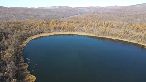 High Altitude Drone Ascending Over Arxan Heavenly Lake Autumn Forest Video stock 330234736