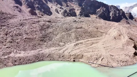 High-altitude drone flight over Manshuk Mametova glacial lake at 3400m Stock Footage 331526877