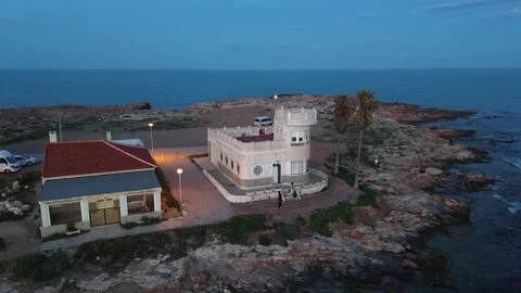 High Altitude Drone Flyover of Rugged Shoreline Vídeos de archivo 307702756