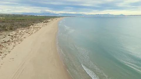 High altitude Drone hovering over sandy beach Stock Footage 325628546