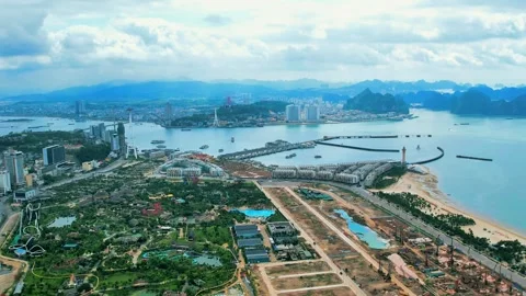 High altitude drone orbit of a unique bay city split by an ocean channel 4K Stock Footage 336650874
