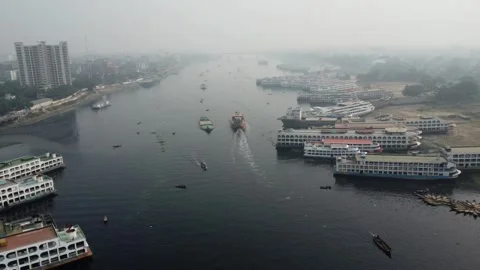 High Altitude Drone Pan Over Buriganga River Showing Boats and Ferries in Dhaka Stock Footage 327229838