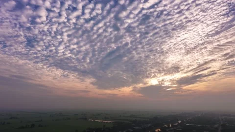 High Altitude Drone Pan Over Rural Landscape Under Epic Sunrise Mackerel Sky Vídeos de archivo 344838001