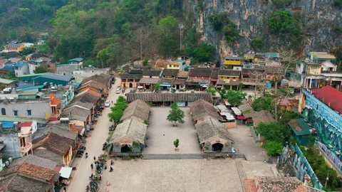 High altitude drone panorama of Dong Van valley town in mist 4K Stock Footage 339044929