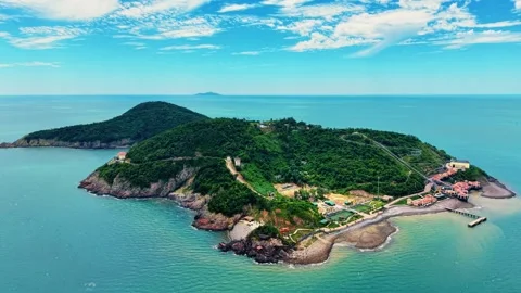 High altitude drone pull back showcasing Song Ngu Island resort 4K Stock Footage 340304072