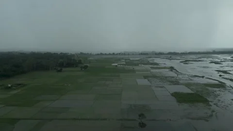 High altitude drone shot of dark storm clouds and rain front moving over co.. Video stock 345042442