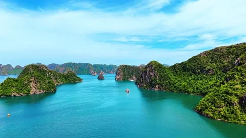 High altitude drone sweep over towering limestone islands in Ha Long Bay 4K Stock Footage 340745081