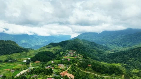 High altitude drone sweep over mountain top villages in Ha Giang 4K Stock Footage 341544063