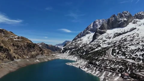 High Altitude Drone Tracking Over Passo Fedaia Roads and Alpine Slopes Video stock 339842010
