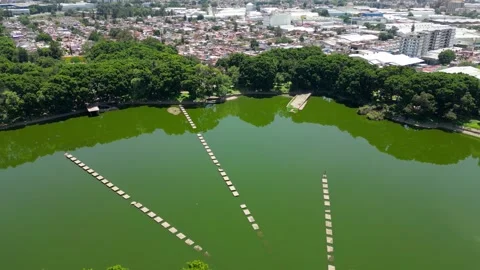High altitude drone video flying over the lake of El Dean park in Guadalajara Stock Footage 321701460