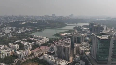 High-altitude drone view of a developing Indian city, capturing rooftops Video stock 325695378