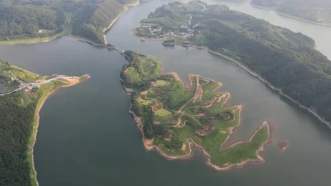 High Altitude Drone View of a Green Island and Reservoir in South Korea Stock Footage 343194236