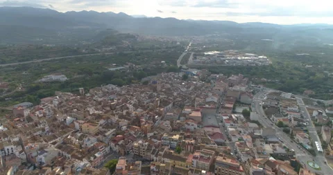 High altitude flight of panoramic view of Sierra town Stock Footage 214662208
