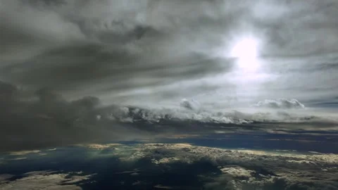 High-Altitude Flight Through a Dramatic Sky with Multilayered Clouds with a Stock Footage 320929588