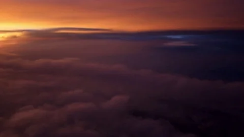 High altitude flight through sunset clouds. Stock-Footage 74393173