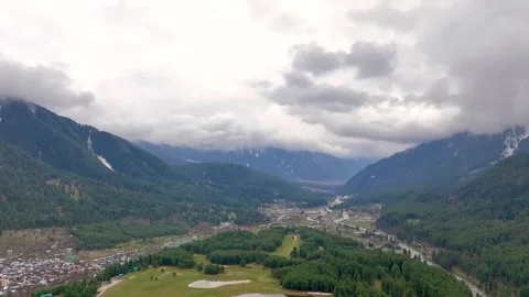 High-altitude forward drone flight over Pahalgam valley and Lidder river. Stock Footage 333796605