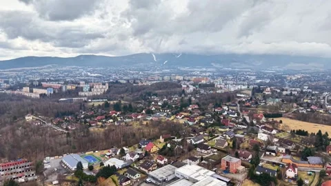 High Altitude Image Revealing Dense Rooftops And Distant Mountain Range Amidst Vídeo Stock 342399937
