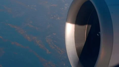 At high altitude, a jet engine of an airplane with a rotating spiral in center Stock Footage 323907152