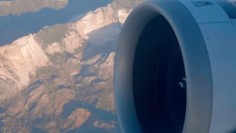 At high altitude, a jet engine of an airplane with a rotating spiral in center Stock Footage 323907455
