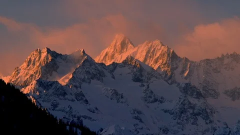 High altitude mountains with cloudy winter sky panorama during sunrise Stock Footage 121576704