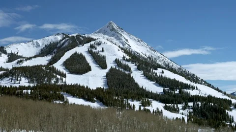High altitude mountains with trees and cloudy blue sky background in day time Stock Footage 121576245