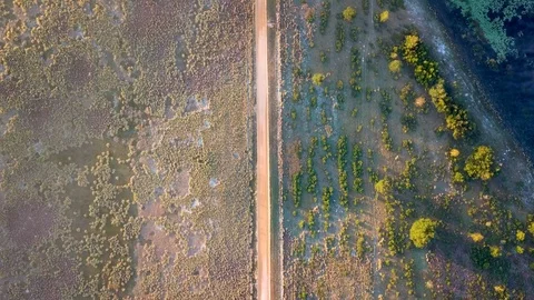 High Altitude Old Rural Dirt Road at Sunrise Aerial Drone Video Stock Footage