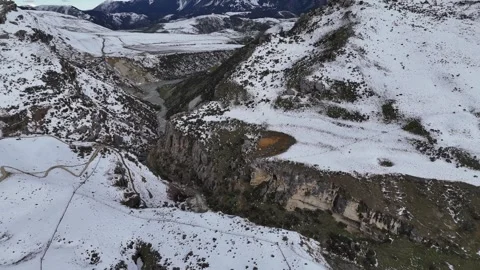 High-Altitude Orbit of a Remote Mountain Lookout Surrounded by Deep Snow Vídeos de archivo 314233334