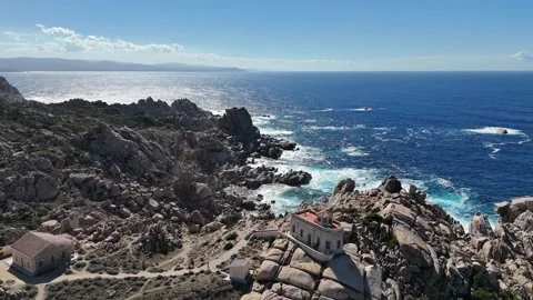 High Altitude Orbital Drone Flight Over Lighthouse and Rocky Coast in Ca Vídeo Stock 332353811