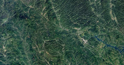 High-altitude overflight aerial of rounded mountains, Guangxi Province China Stock Footage 70825202