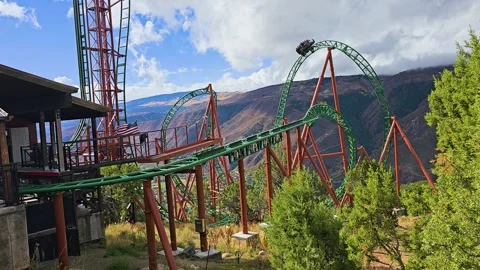 High altitude roller coaster curves over a Rocky Mountain slope near Glenwood Stock Footage 346040942